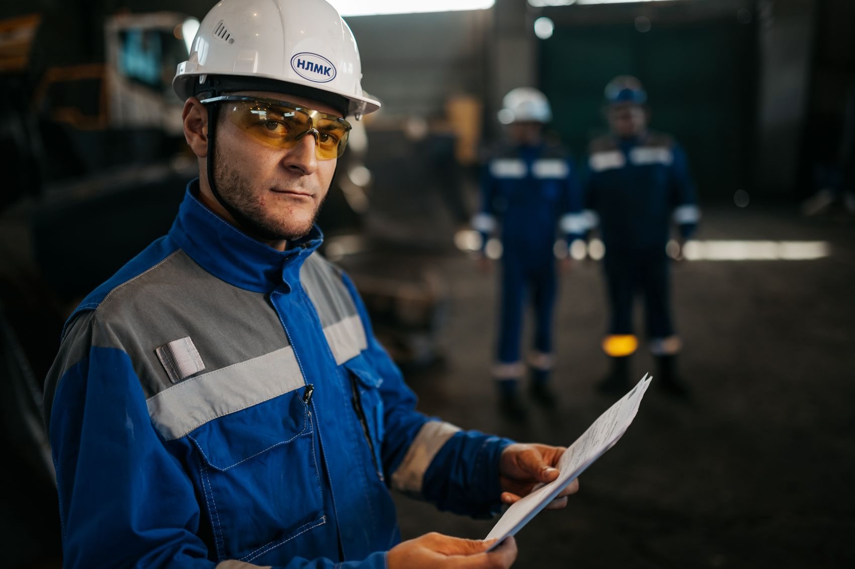 Engineer inspecting plant equipment on a tablet